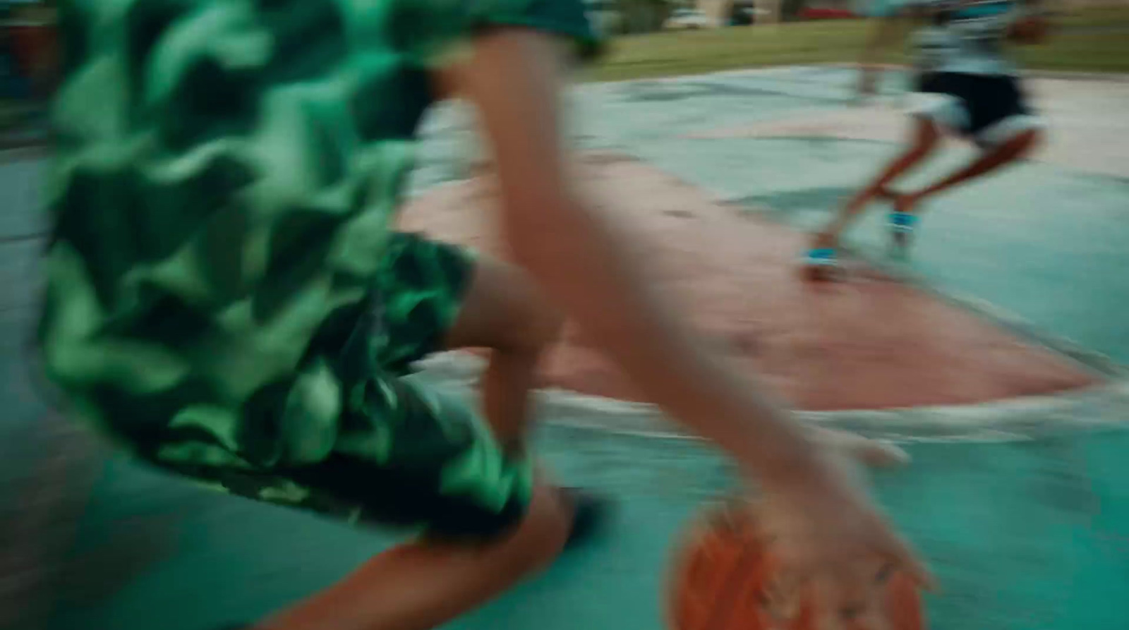 a blurry photo of a person holding a basketball