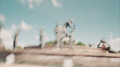 a blurry photo of a person sitting on a bench