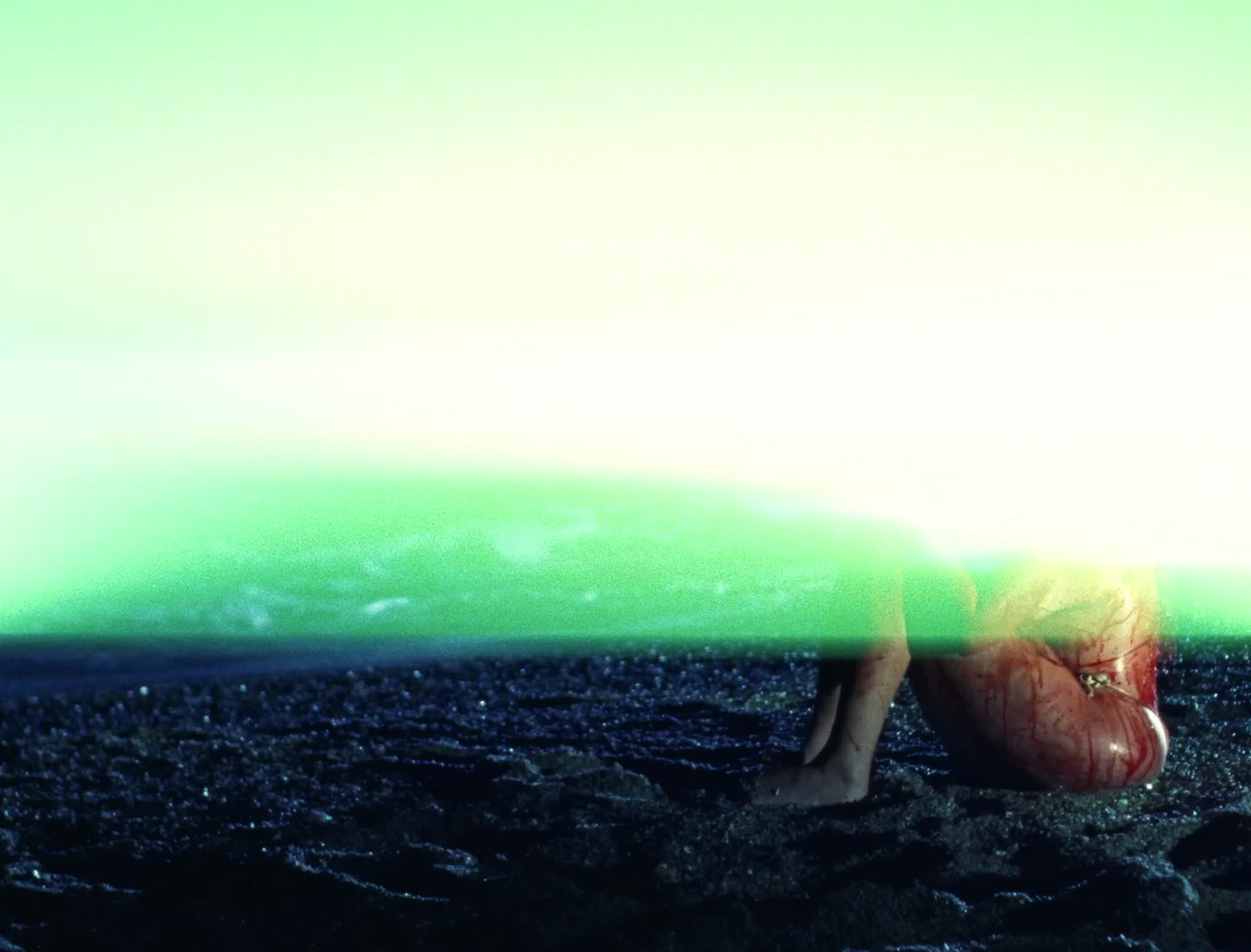 a person laying on the ground with a surfboard