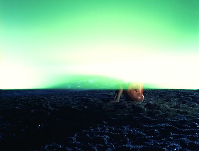 a person laying on the ground in the dark