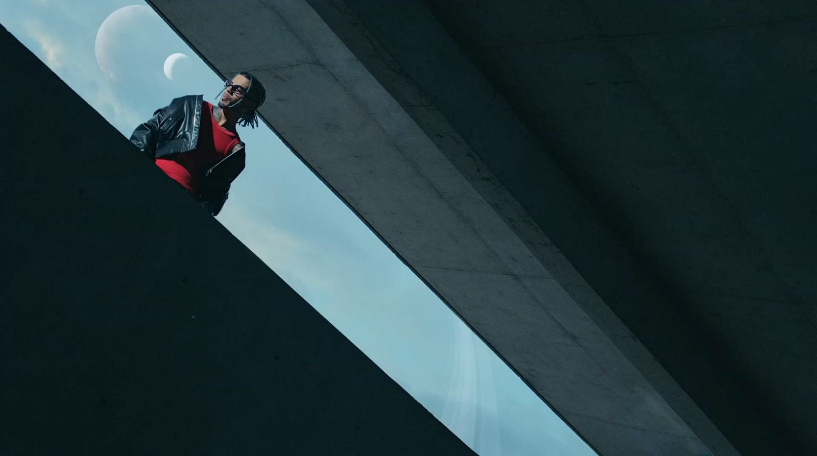 a woman in a black jacket and red skirt