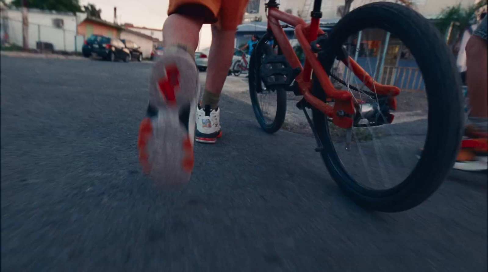 a person riding a bike down a street