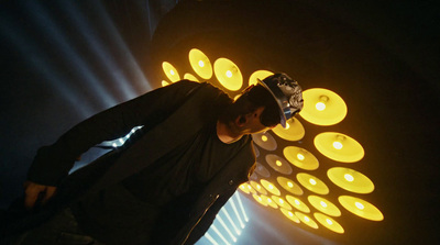 a man standing in front of a display of candles