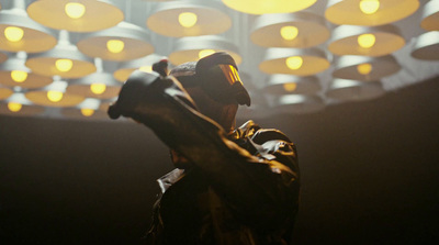 a man standing in front of a ceiling covered in lights