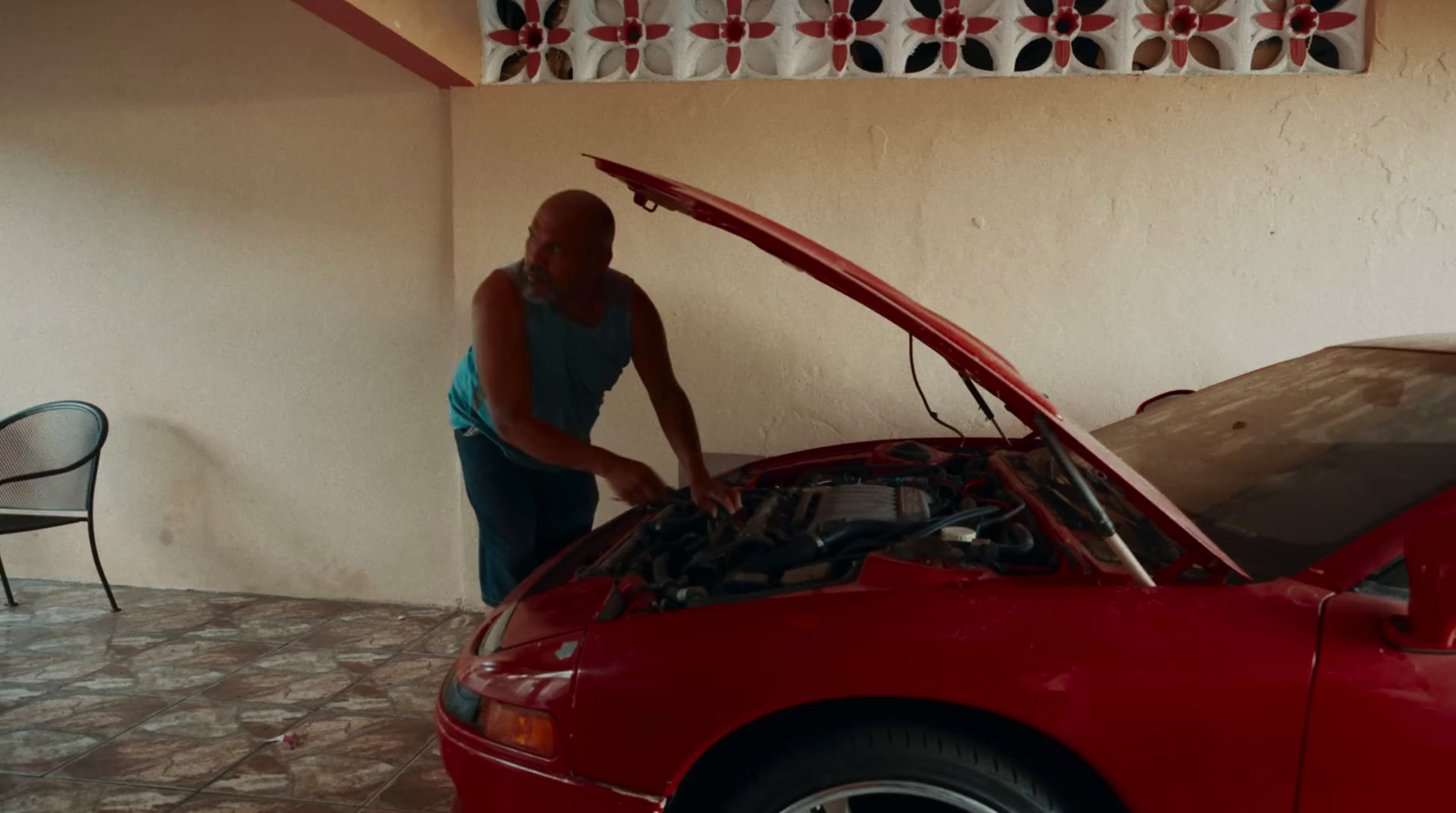 a man working on a car in a garage