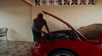 a man working on a car in a garage