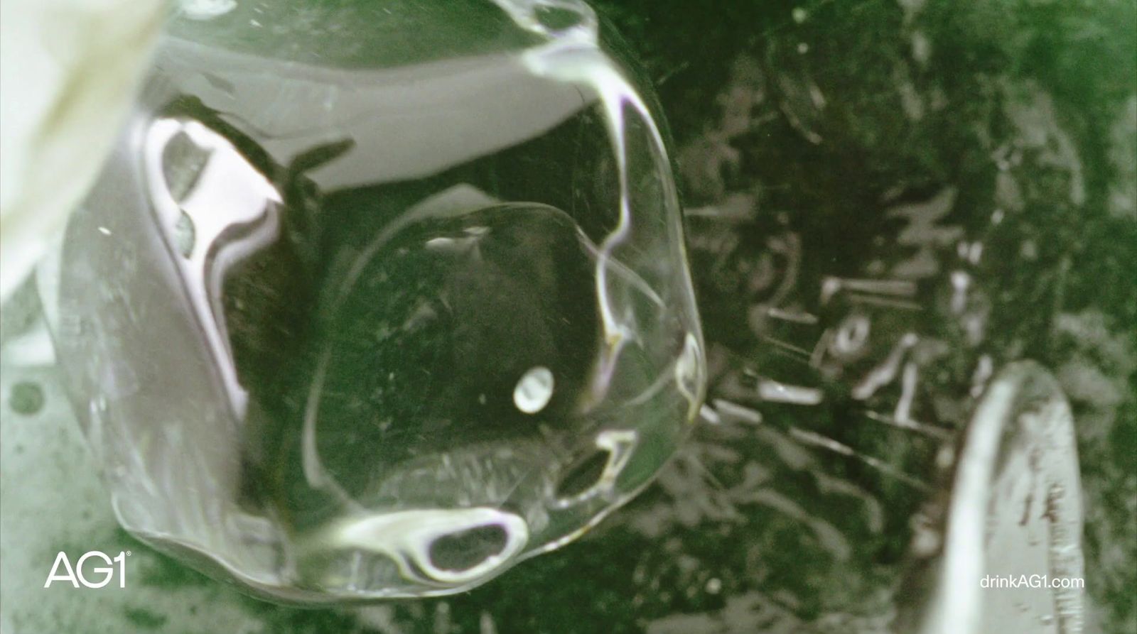 a close up of a glass vase with water in it