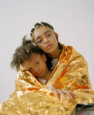 a woman and a child wrapped in gold foil