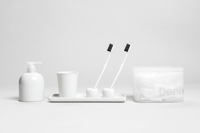 a couple of toothbrushes sitting on top of a white tray