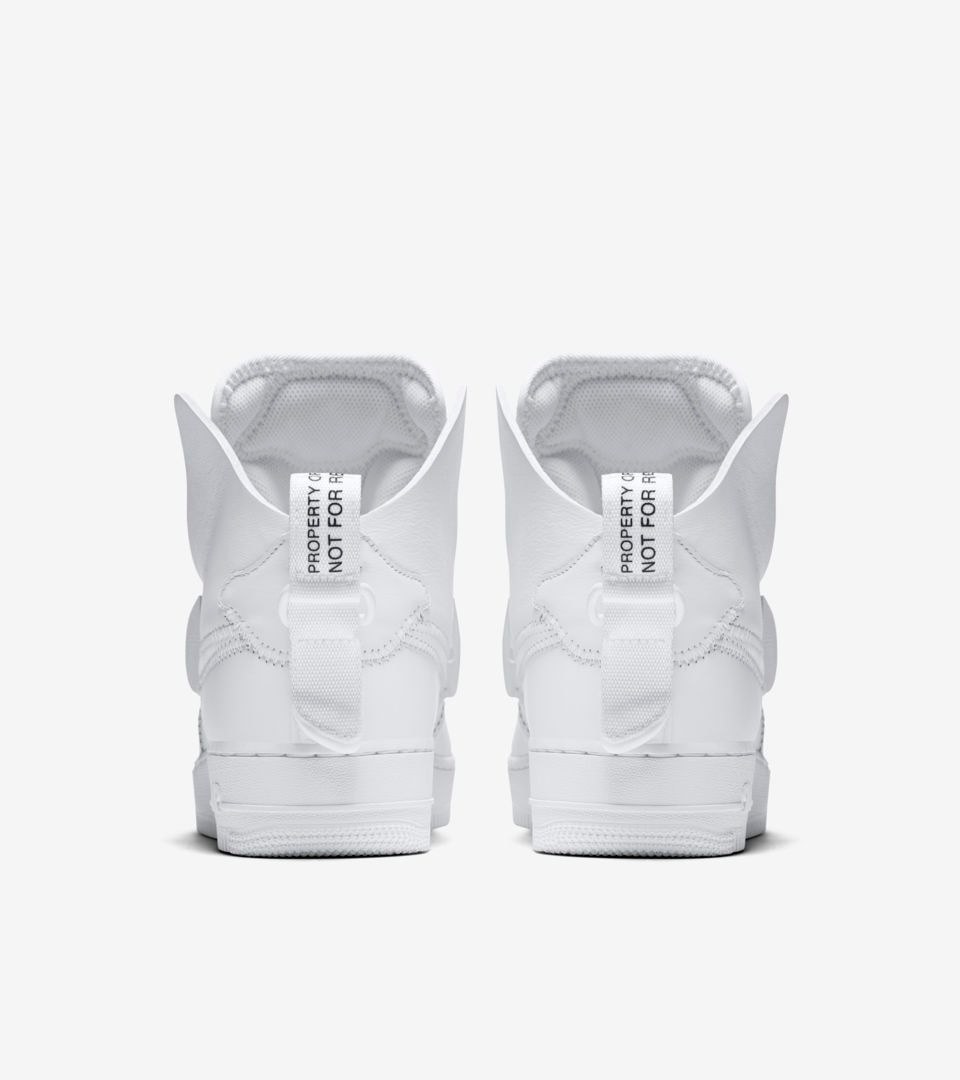 a pair of white sneakers on a white background