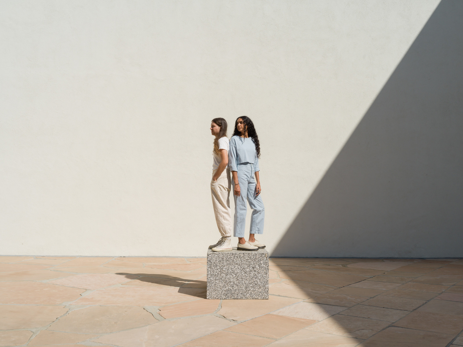 a couple of women standing next to each other