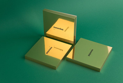 a box with a business card inside on a green surface