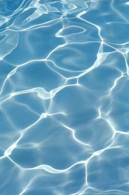 a blue pool with water ripples in it