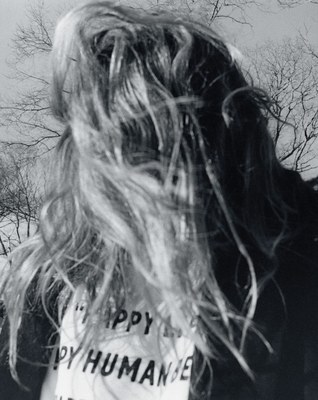 a woman with a sign on her back