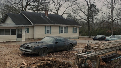 a car that is sitting in front of a house