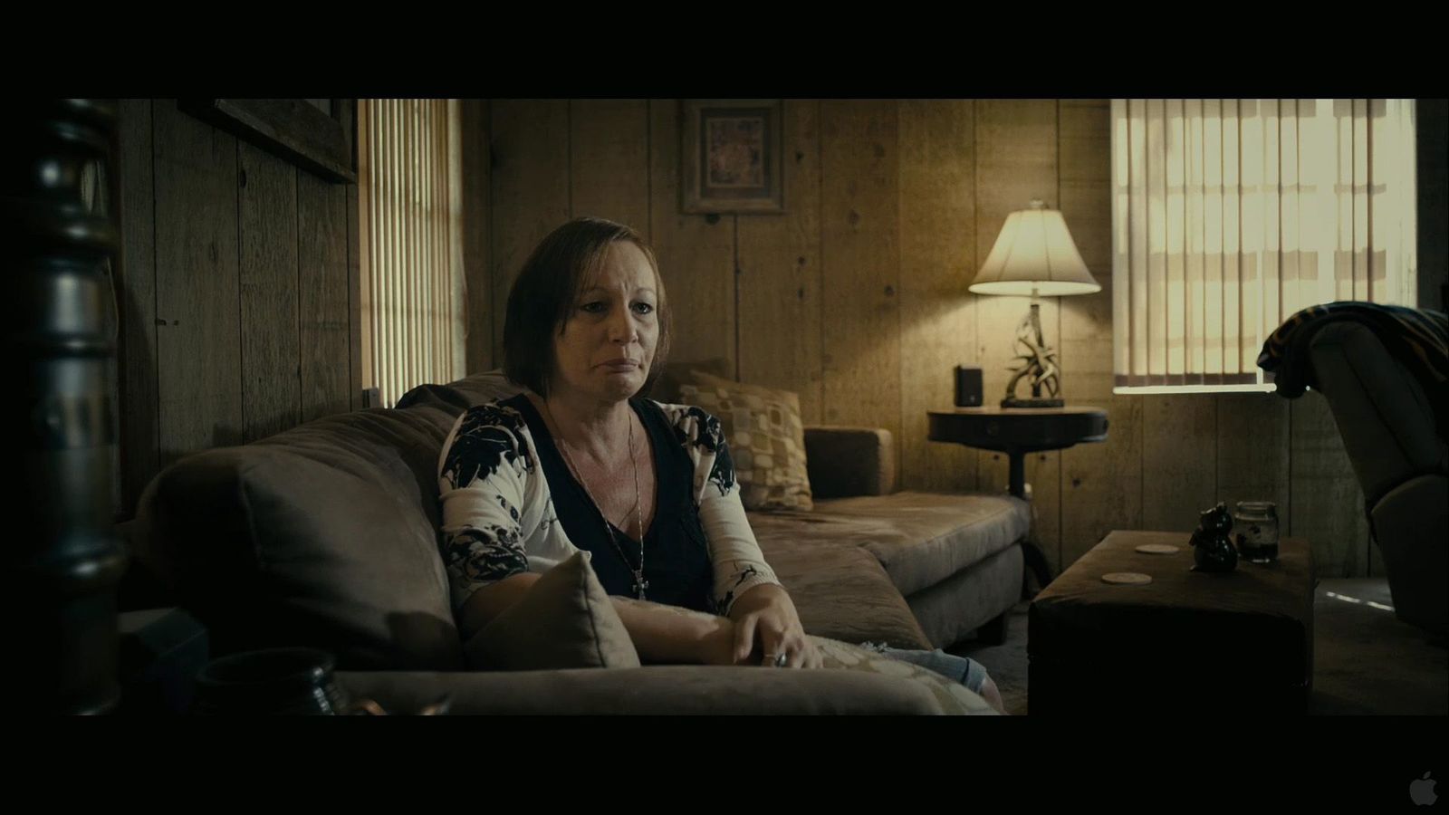 a woman sitting on a couch in a living room