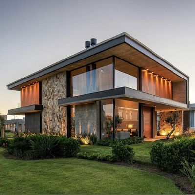 a modern house with a stone and wood exterior