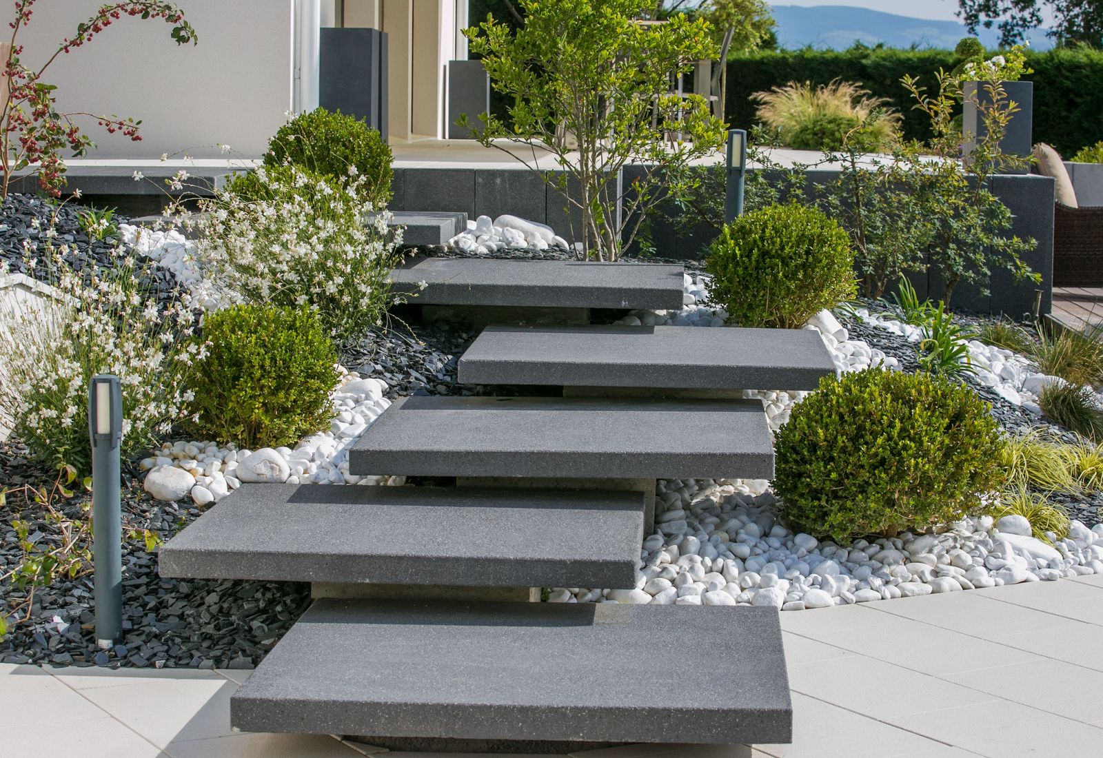 a set of stone steps in a garden