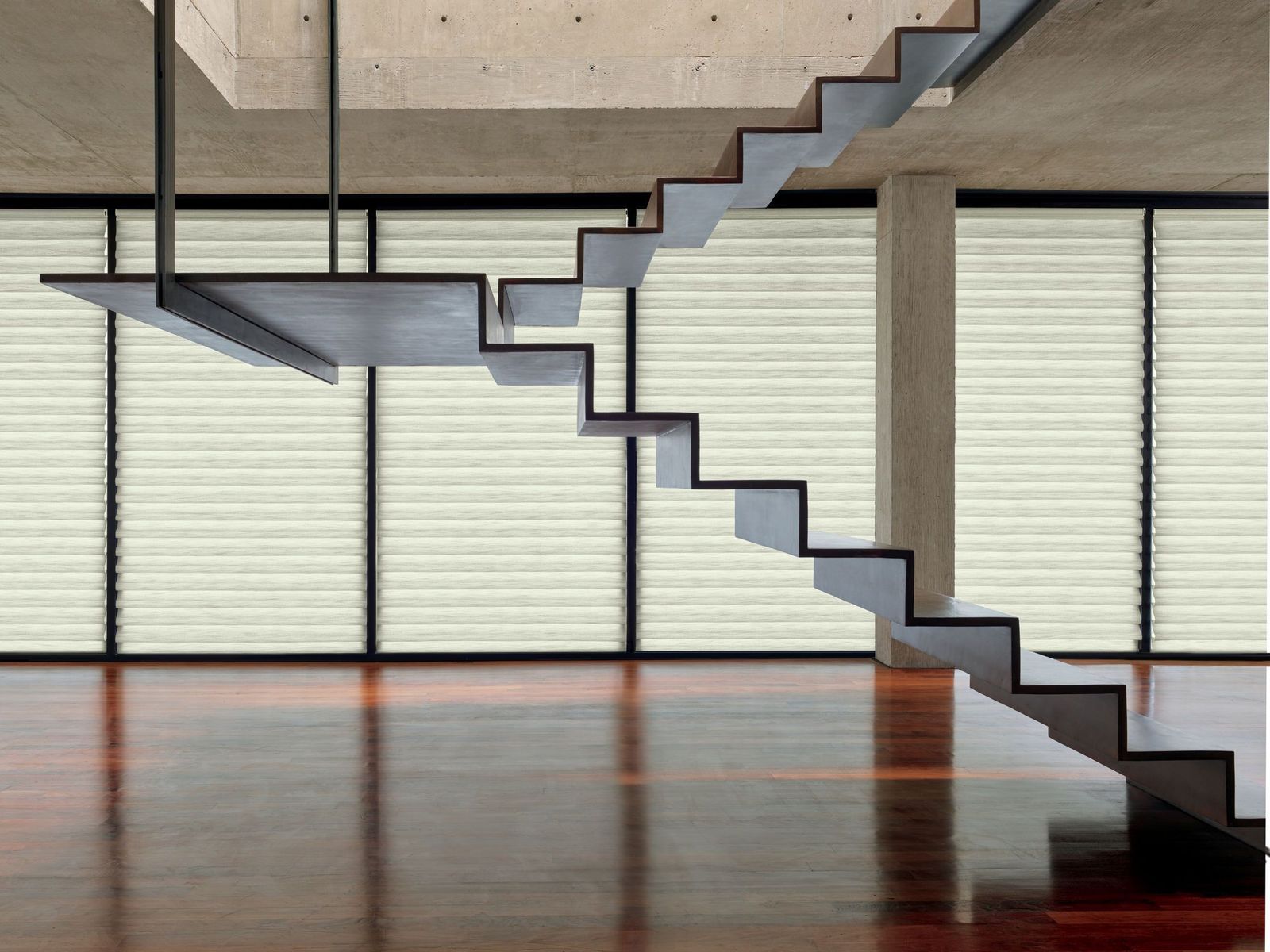 a stair case in a room with a wooden floor