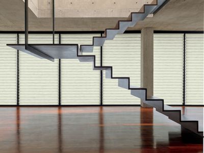 a stair case in a room with a wooden floor