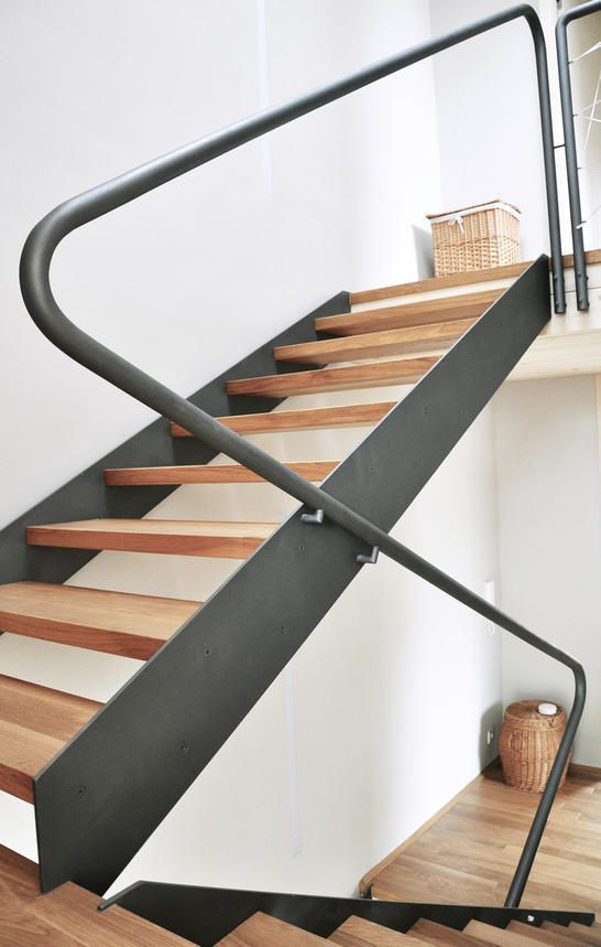 a close up of a metal and wood staircase