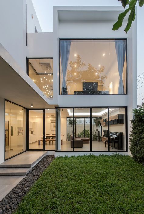 a modern house with a large glass window