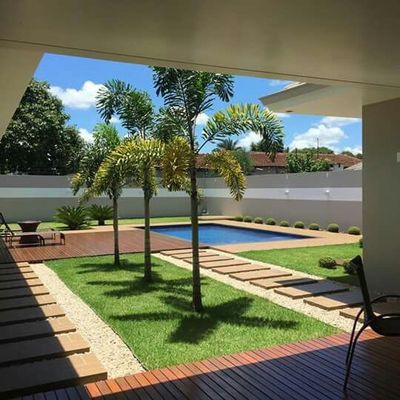 a view of a pool from inside a house