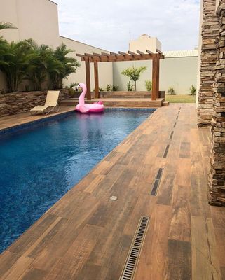 a pool with a pink inflatable floatie in the middle of it