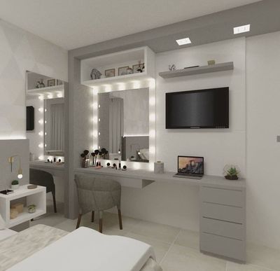 a bedroom with a bed, desk and television