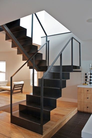 a staircase in a house with a wooden floor