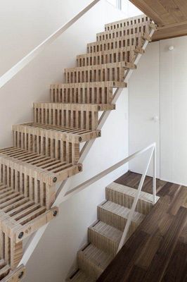 a staircase made out of wooden planks in a house