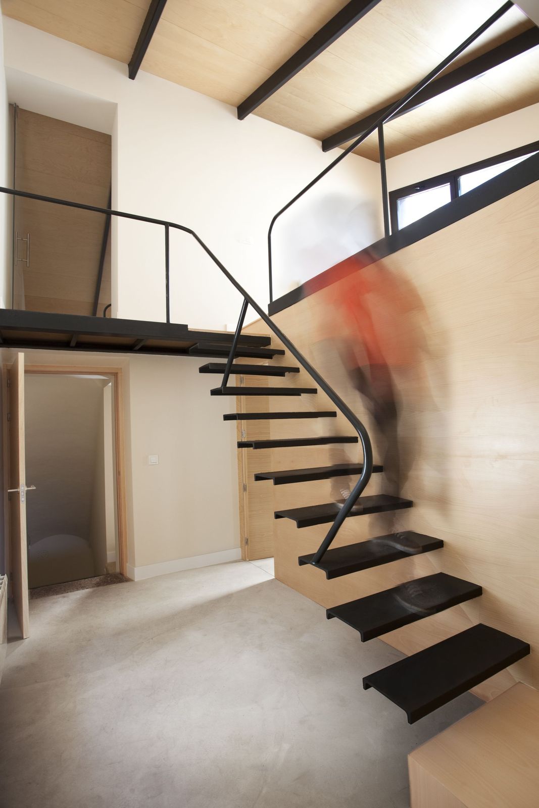 a man riding a skateboard down a set of stairs