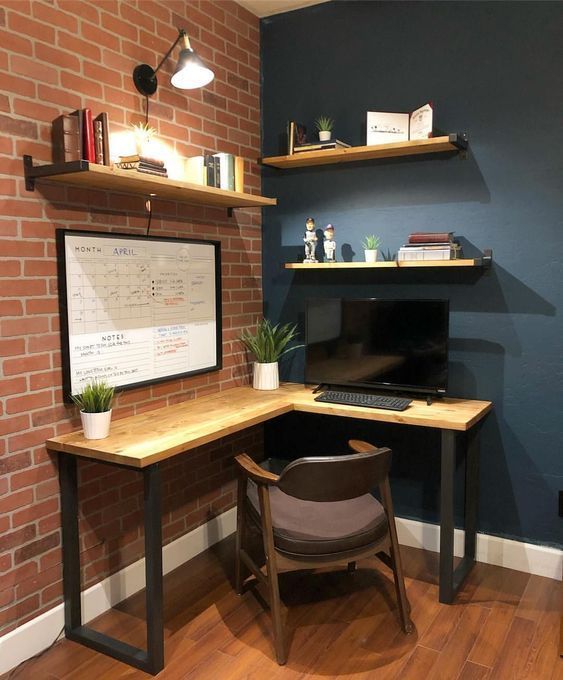 a desk with a chair and a computer on top of it