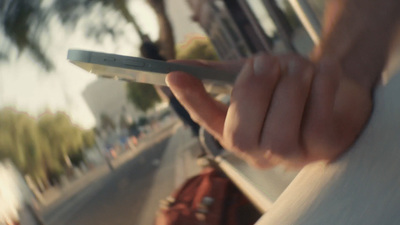 a close up of a person holding a remote control