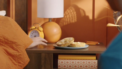 a person sitting at a table with a plate of food