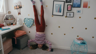 a person upside down in a room