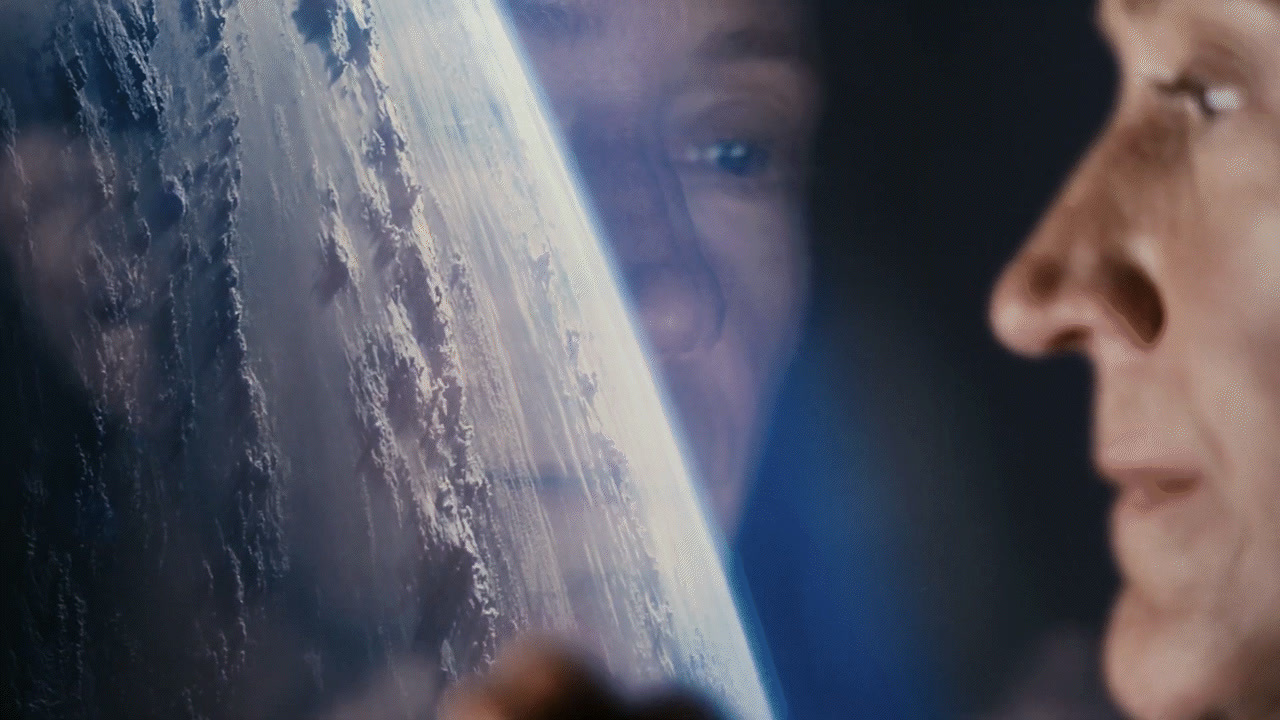 a close up of a person looking at the earth