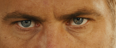 a close up of a man with blue eyes