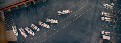 a parking lot filled with lots of parked cars