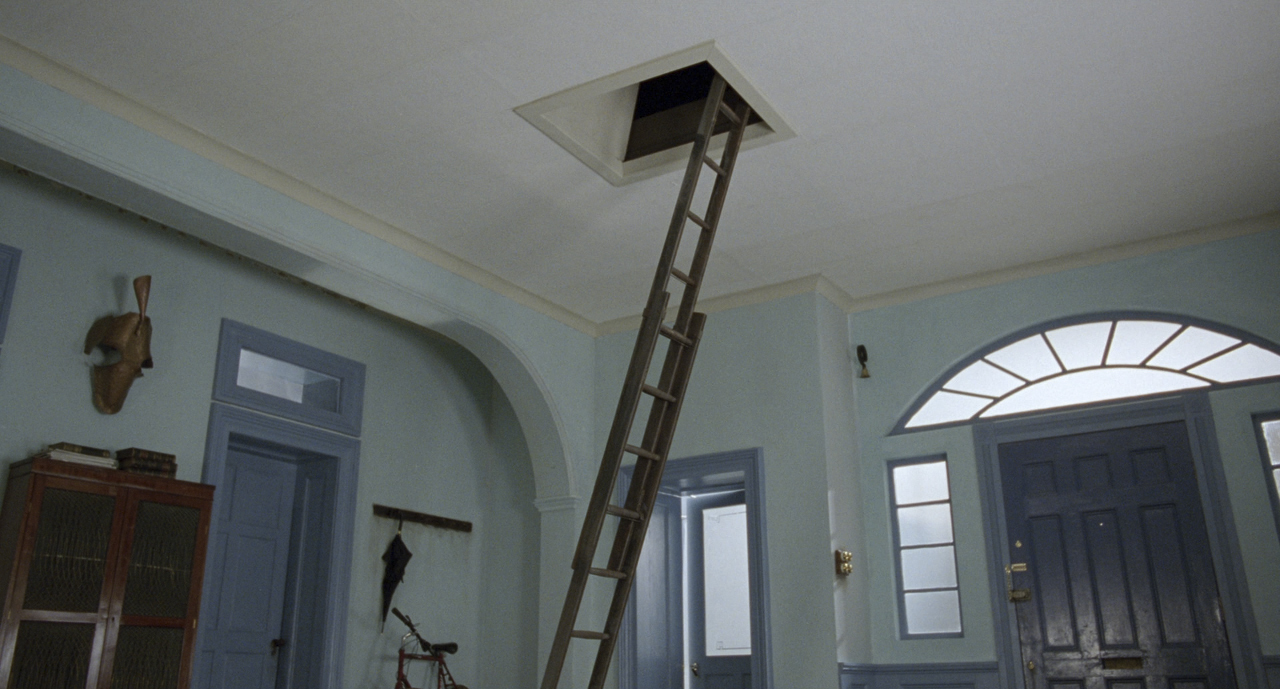 a ladder leaning up against a wall in a room