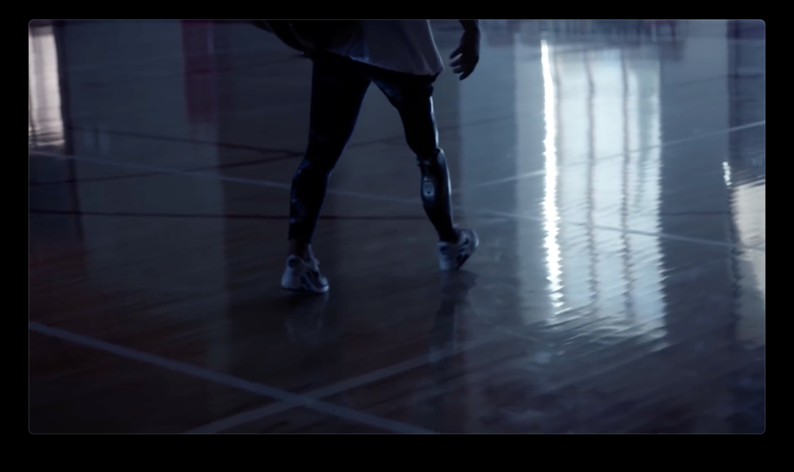 a person walking on a tiled floor in a building