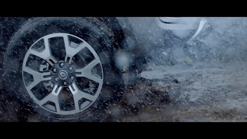 a close up of a tire on a car in the snow