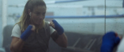 a woman with blue gloves on her hands