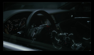 the interior of a car with a steering wheel and dashboard