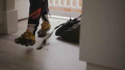 a pair of feet with yellow and black shoes