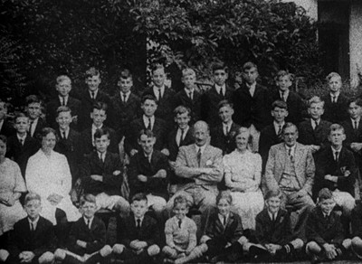 a group of men and women posing for a picture