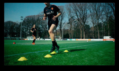 a man is running on a soccer field