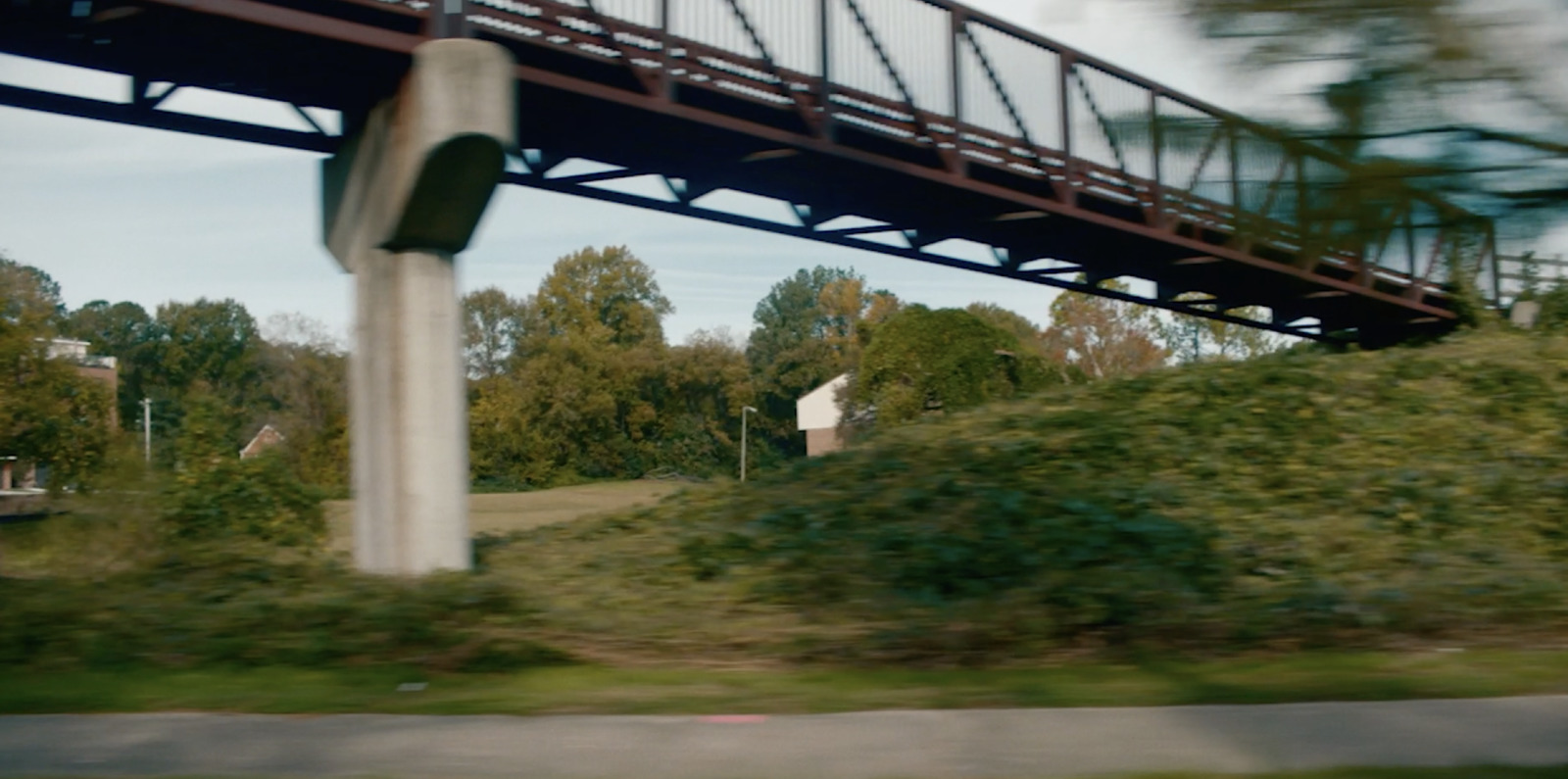 a view of a bridge from a moving vehicle