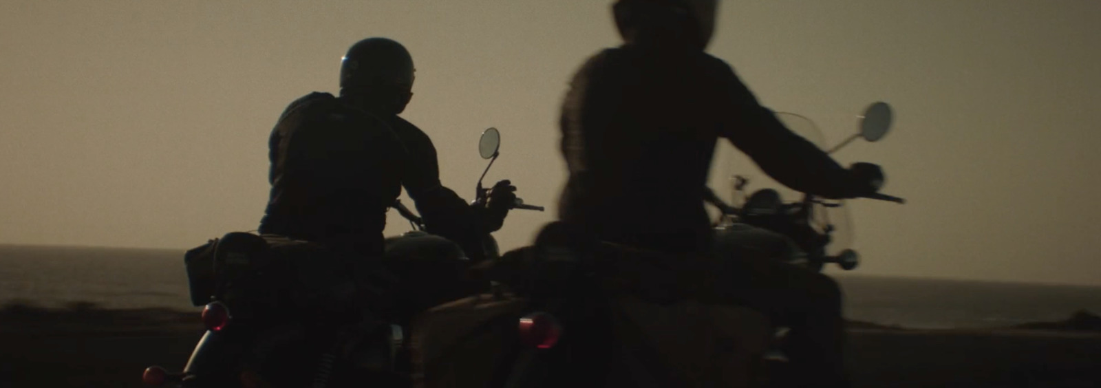 a couple of people that are on motorcycles
