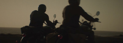 a couple of people that are on motorcycles